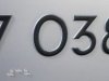7038